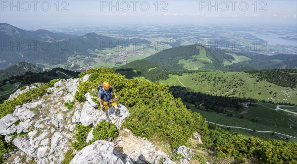 Climber on a climbing tour, climber on a mountain ridge, alpine climbing, crossing the Kampenwand,