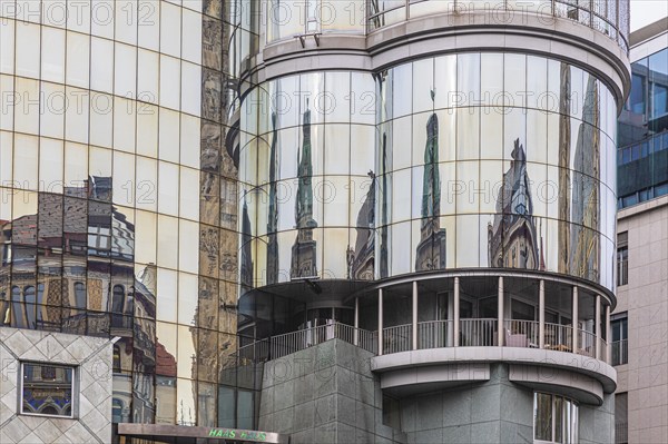 Reflections on the glass façade of the Haas Haus on Stephans-Platz, Vienna, Austria, Europe