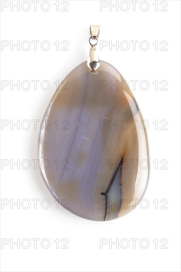 Colored onyx pendant isolated on white background, close up