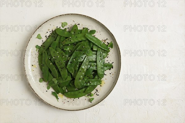 Salad of young peas, in pods, with sesame seeds, asian cuisine, homemade