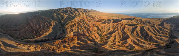 Aerial view, eroded mountain landscape, sandstone cliffs, canyon with red and orange rock