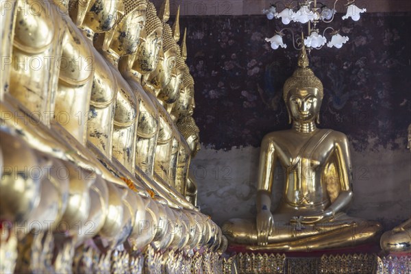 Golden Buddha statues, Bhumispara-mudra, Buddha Gautama at the moment of enlightenment, Wat Suthat