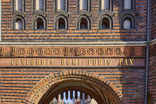 City gate Lübeck Holstentor, inscription Concordia domi foris pax with the meaning harmony inside