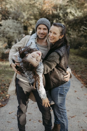 Parents with daughter, family photo