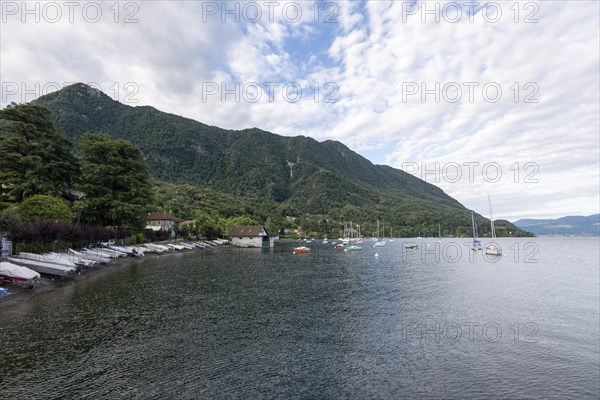 Boats moored on the shore of Lake Maggiore, Castelveccana, Lombardy, Italy, Europe