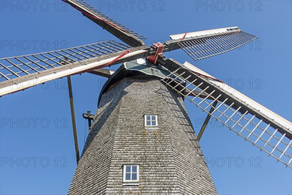 Lattice work of sails from 19th century wooden octagonal windmill Schulen at open air museum