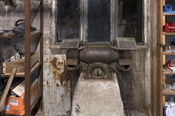 Old grinding machine in a former LPG workshop in the GDR, Mecklenburg-Vorpommern, Germany, Europe