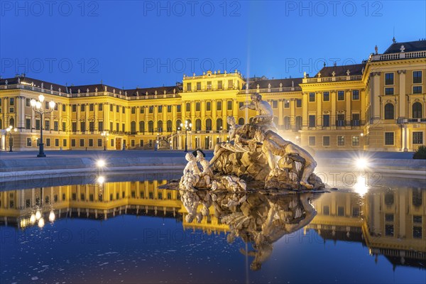 Fountain in the courtyard of honour at Schönbrunn Palace at dusk, UNESCO World Heritage Site in
