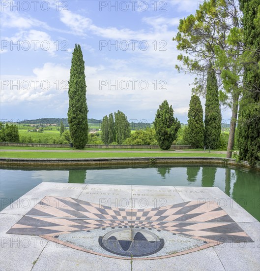 Horizontal sundial and pond in Parco Giardino Sigurtà, Valeggio sul Mincio, Province of Verona,