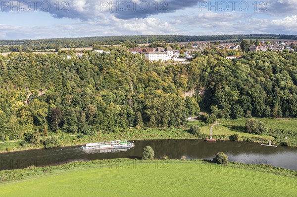 Aerial view of excursion boat on the Weser river passing castle Fürstenberg, Weserbergland,