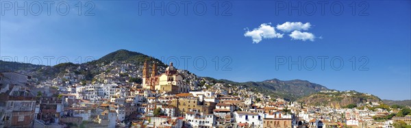 Mexico, Scenic panoramic view of Taxco historic center with colonial houses on the hills and famous