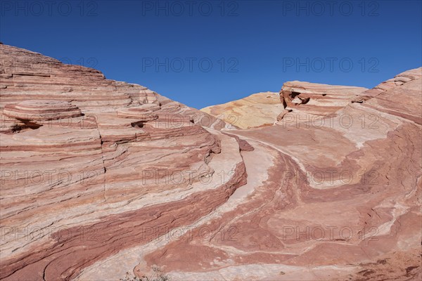 Layered rock formations along the Fire Wave Trail at Valley of Fire State Park near Overton, Nevada