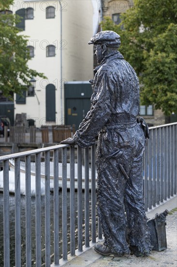B&W Worker, sculpture by Jens Galschiøt, Børnehusbroen, Christianshavns Kanal, Copenhagen, Denmark,
