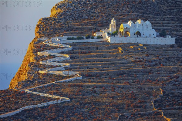 View of Panagia Kimissis church built on a cliff above the sea, Chora, Folegandros Island, Cyclades