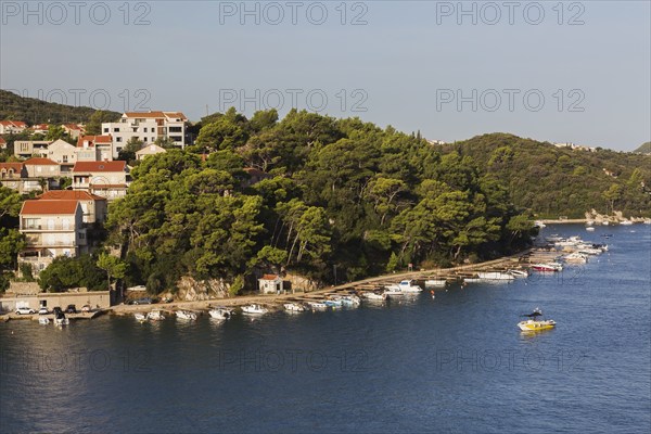High angle view of tan and white trim houses and villas with traditional terracotta clay tile