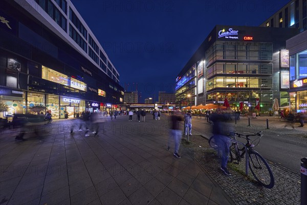 Rathausstraße with shops and cinema complex Cine Star in the evening, Berlin, capital city,