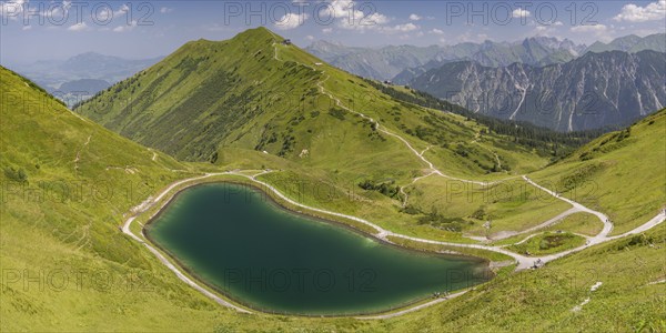 Riezler Alpsee, an artificial lake, snow pond, feeds the snow cannons that completely cover the