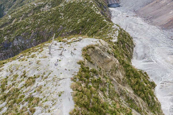 Tourists at the viewing point, hike to crater rim of Chaiten volcano, Park Pumalin, Patagonia,
