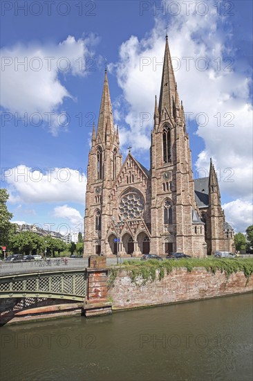 Neo-Gothic St Paul's Church with twin towers and Pont d'Auvergne over the Ill, river, bridge,
