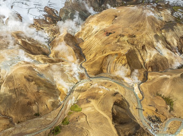 Steaming hot springs and colourful rhyolite mountains, aerial view, Hveradalir geothermal area,