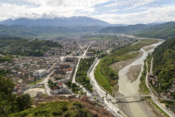 View looking over city centre of Berat in valley of River Osum with mountains beyond, Berat,