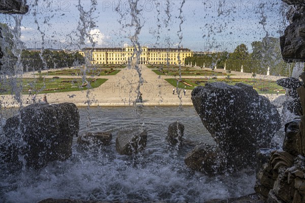 View through the Neptune Fountain to Schönbrunn Park and Palace, UNESCO World Heritage Site in