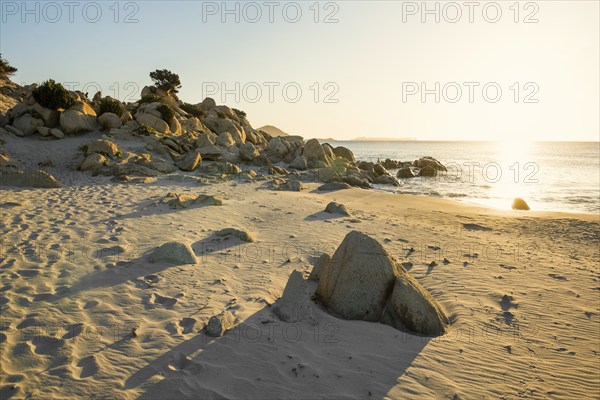 Lonely beach and rocks, sunrise, Spiaggia di Porto Giunco, Villasimius, south coast, Sardinia,