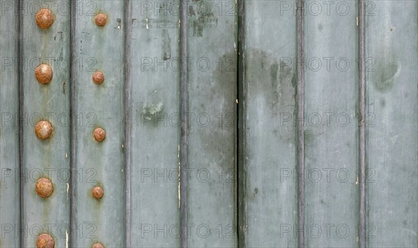 Old wooden gate with metal rivets, background, texture, Apulia, Italy, Europe