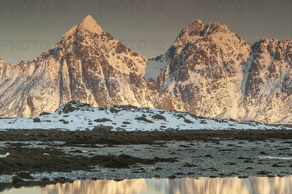 Rugged mountains, Lofoten island Vestvågøya at the fjord Gimsøystraumen, Lofoten, Northern Norway,