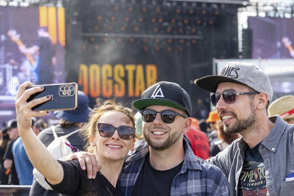 Adenau, Germany, 8 June 2024: Fans enjoy Dogstar (bass, Keanu Reeves) at Rock am Ring. The festival