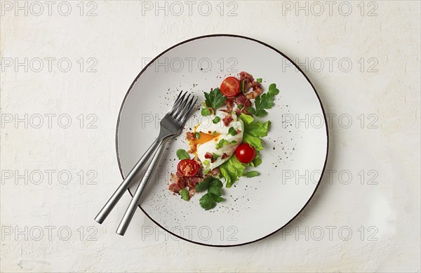 Poached egg, with bacon and vegetables, breakfast, homemade