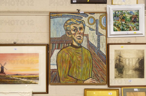Man inside a boat picture artwork in style of John Bratby plus other pictures on display at