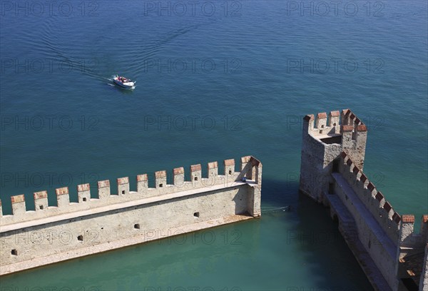Harbour basin of the castle with flat Guelph battlements, Scaliger Castle, Castello Scaligero, in