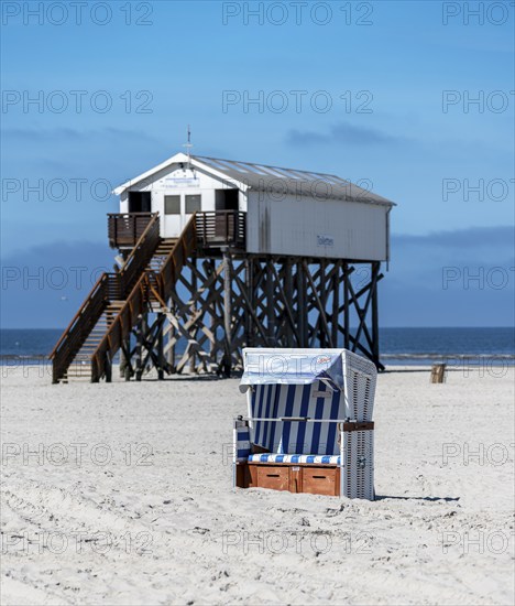 Beach chairs and signs on the sandy beach of the North Sea, Sankt Peter-Ording, Schleswig-Holstein,