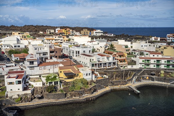 View from the Mirador El Tamaduste of the natural swimming pool and the village of Tamaduste, El