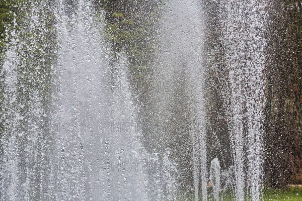Water fountains, water features, spray mist, park in city centre, symbol photo, urban microclimate,
