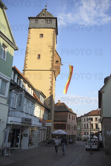 Bavarian tower built 14th century with flag and town coat of arms in Lohr am Main, Lower Franconia,