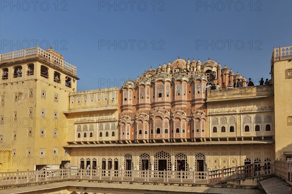 JAIPUR, INDIA, NOVEMBER 18, 2012: Tourists visiting Hawa Mahal palace (Palace of Winds), famous