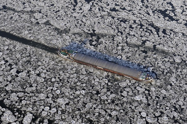 Aerial view of a barge during ice conditions on the Elbe, transport, traffic, weather, climate,