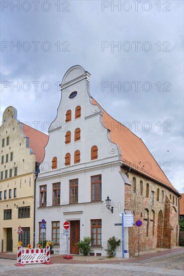 Crooked Baroque gabled house and former warehouse, heritage-protected corner building Am Poeler Tor
