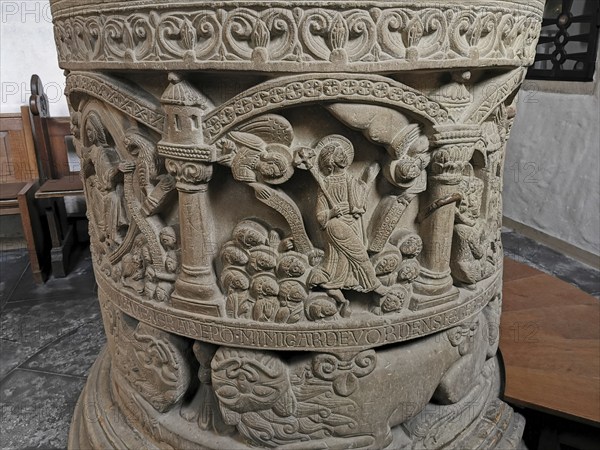 Romanesque baptismal font from 1129 in the former collegiate church of St. Boniface, relief