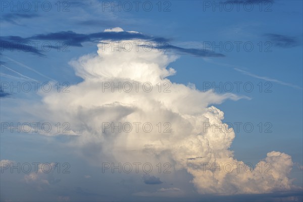 Cumulonimbus, thundercloud against blue sky, Germany, Europe