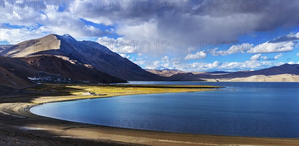 Panorama of Himalayan lake Tso Moriri and Korzok village in Himalayas on sunset, Ladakh, India,