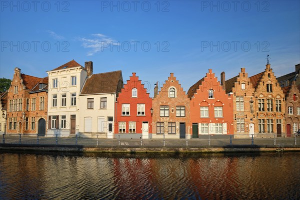 Typical Belgian cityscape Europe tourism concept, canal and old houses on sunset. Bruges (Brugge),