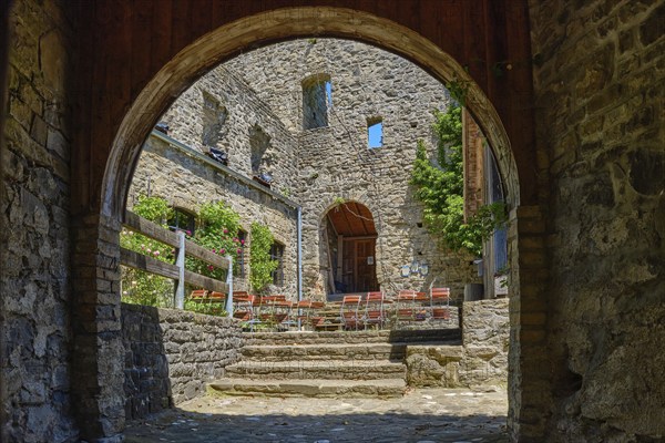 View through the castle gate into the castle courtyard, medieval castle ruins Sulzberg in Allgäu
