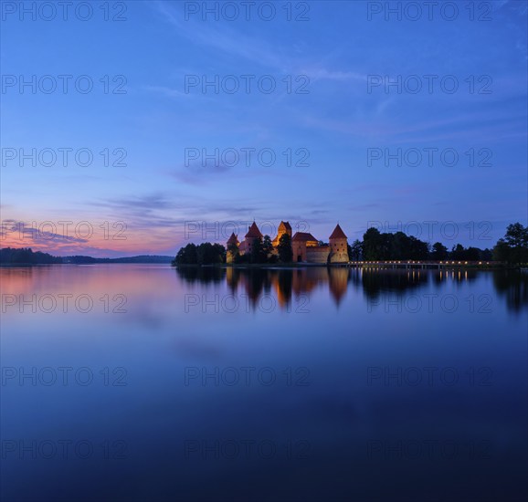 Evening view of Trakai Island Castle in lake Galve illuminated in the night, Lithuania. Square