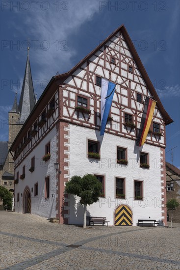 Historic town hall, half-timbered 1540, St. Michael's Church in the back, Zeil am Main, Lower