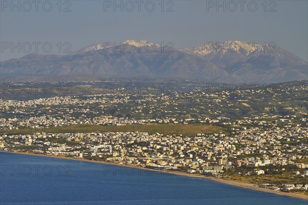 Panorama shot, overview, Dikte massif, snow-capped mountains, sea of houses, blue sea, coast,