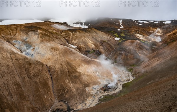 Steaming streams between colourful rhyolite mountains, Hveradalir geothermal area, Kerlingarfjöll,