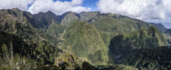 Densely overgrown steep mountains, green mountain landscape, view from the Miradouro dos Balcões,